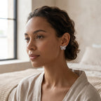 Woman wearing a butterfly moissanite stud earring with an elegant updo