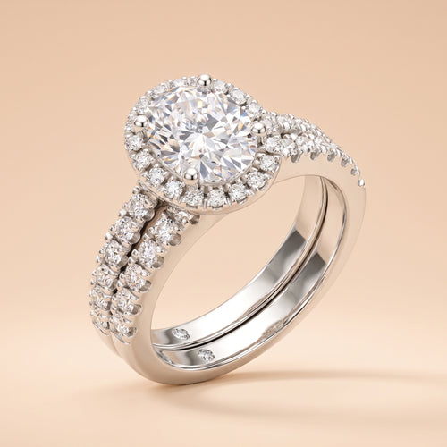 2 CT oval-cut halo moissanite bridal ring set in 925 sterling silver on a peach background