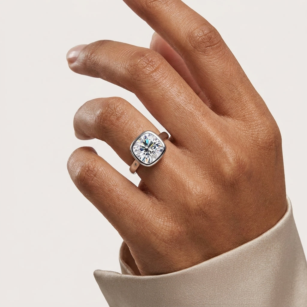 Woman wearing a 3 CT cushion-cut moissanite solitaire engagement ring