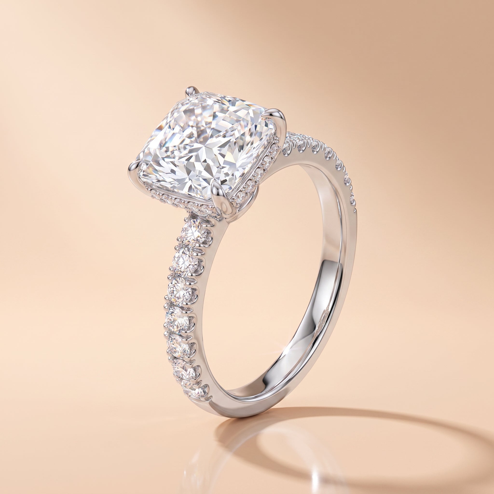3 CT radiant-cut moissanite engagement ring with pavé band on a beige background