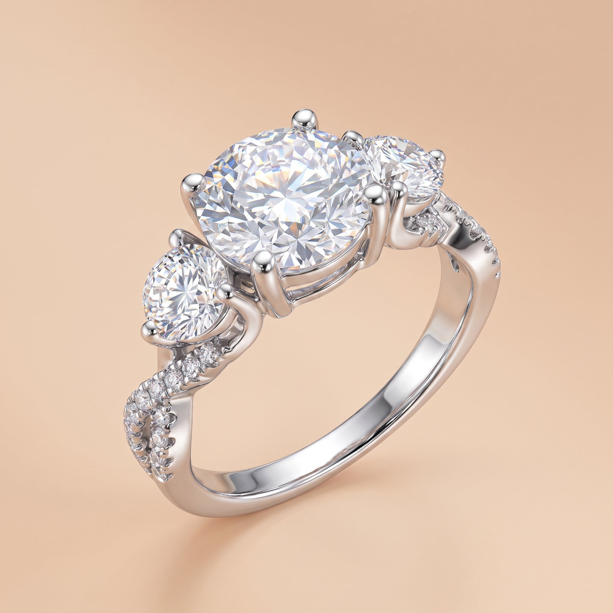 4.25 CTTW three-stone round-cut moissanite engagement ring in sterling silver on a beige background.