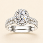 Front view of an oval-cut halo moissanite engagement ring with a matching pavé band