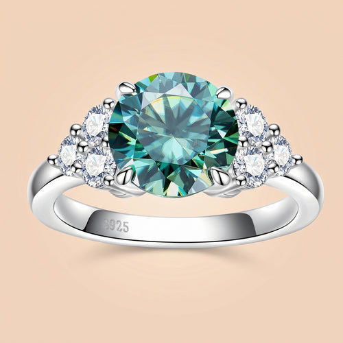 Front view of a 3 CT round-cut green moissanite engagement ring with side stones
