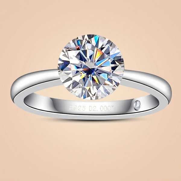 2 or 3 CT round-cut moissanite engagement ring with an invisible setting