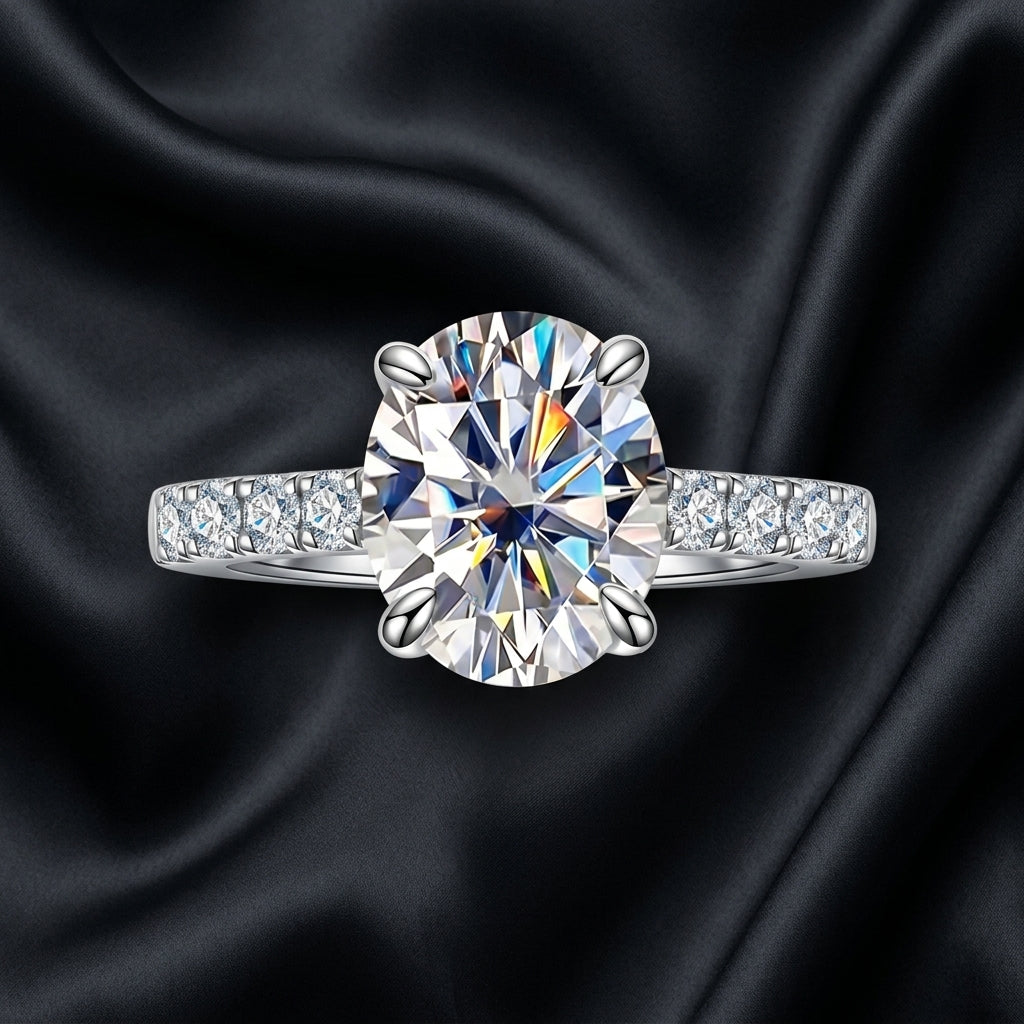 Close-up of a round-cut moissanite engagement ring on black satin